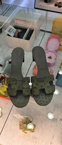 Used olive green heeled slide sandals, size unknown - good condition