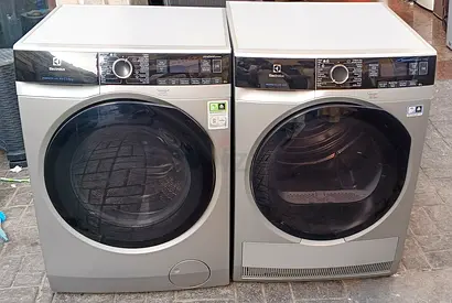 Electrolux front-load washer and dryer pair set - silver, good condition 10 washer 9 kg dryer