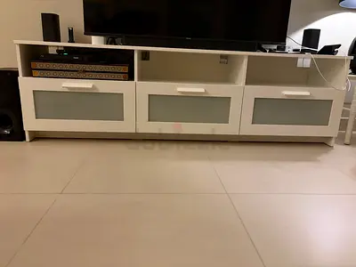 White TV cabinet with storage and glass-front doors