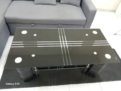 (Used) Black glass coffee table with chrome legs - good condition