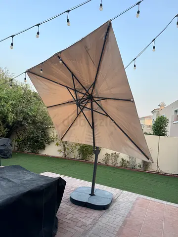 Large cantilever patio umbrella with weighted base - beige