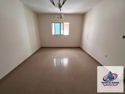 Second Occupancy Spacious 1BHK in Al Butina with Central AC and Gas Very Clean Family Building Prime Location Easy Access to Dubai and Ajman