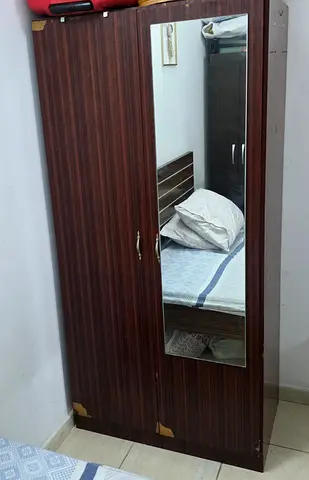 Two-door wooden wardrobe with full-length mirror - good condition