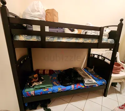 Solid dark wood bunk bed - sturdy twin over twin frame.