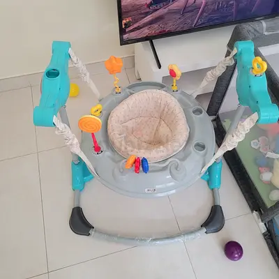 Baby Bouncer / Jumper with Toys — Good Condition