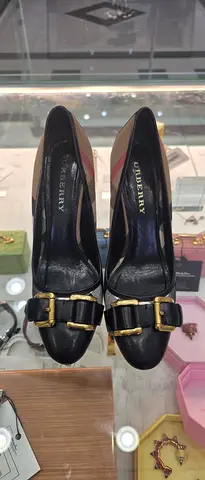 Black Burberry leather loafers with gold buckles, size unknown — gently used