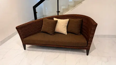 Curved rattan couch
