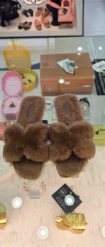 Brown fuzzy bunny slippers — cozy indoor women's slides, size not specified