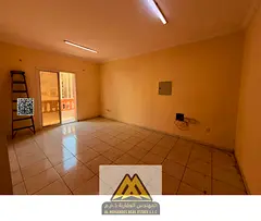 2BR in Al Nuaimiya 2, separate hall, balcony, 2 baths, central AC, maintenance, King Faisal St, AED 