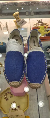 Blue canvas espadrille slip-on shoes, size not specified