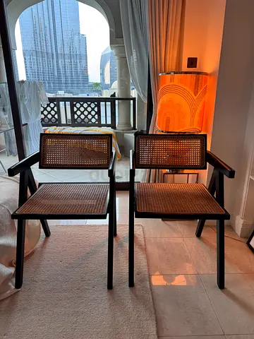 Set of 2 Black Wooden Chairs with Cane Seats. Some scratchy by otherwise in very good condition.