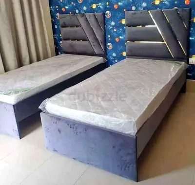 New Pair of single beds with upholstered headboards and new mattresses