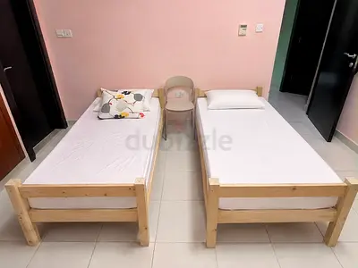 Two wooden single beds with mattress available for sale!