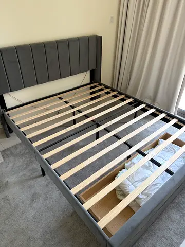 Grey upholstered queen bed frame with slatted base - perfect condition