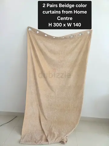 Pair of beige grommet curtains (300 x 140 cm) from Home Centre