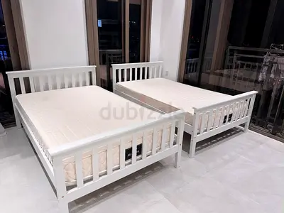 Pair of white wooden single beds with mattresses - excellent condition-can be used as bunk beds too