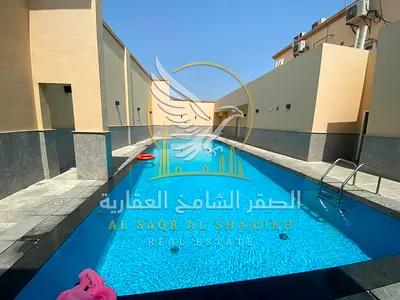 the finest two bedroom apartment with a spacious hallway and built in wardrobes with parking gym and swimming pool