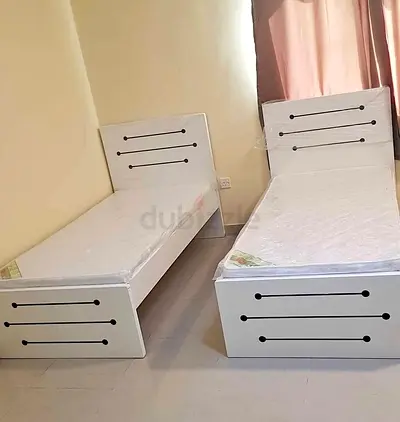 New Pair of single white wooden beds with mattresses