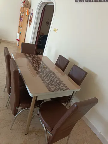 6-Seater Glass Top Dining Table with Brown Upholstered Chairs