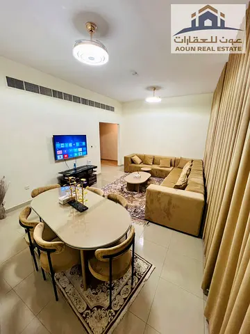 Excellent, high-end two-bedroom apartment with a living room in Al-Thuraya Tower; includes a private parking space.