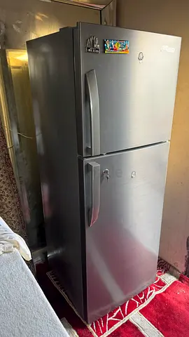 Used silver double-door refrigerator - good working condition