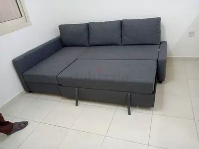 Grey fabric L-shaped pull out sofa bed