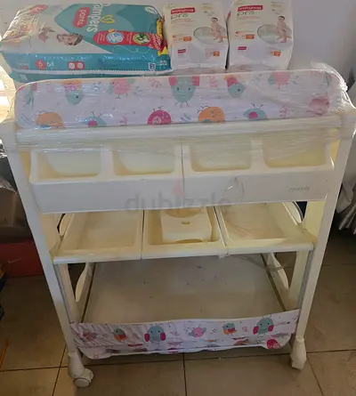 Juniors baby bath & changing table +daipers