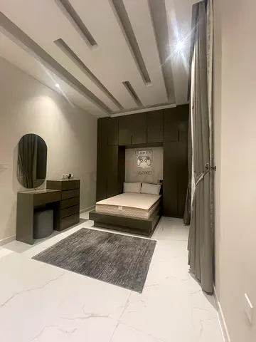 Modern grey bedroom set with bed, wardrobe and bedside table - good condition