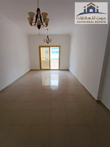 Two bedrooms and a living room for annual rent in Al Majaz 3; includes a balcony and parking. The Owner covers the contract fees.
