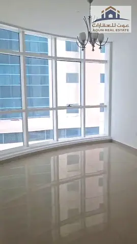 Two bedrooms and a living room for annual rent in Al Taa'won, right by the Dubai exit, for 43,000 with a parking space, 6 installments,