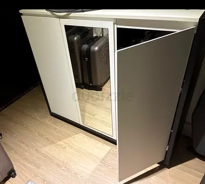 Compact white wardrobe cabinet with mirror — good condition