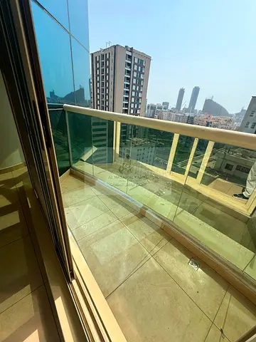 For rent: a spacious 3-bedroom apartment with a living room in Al Majaz 3, Sharjah, in a prime location on Al Ittihad Road, with a maid’s room, laundr