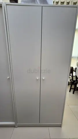 IKEA Kleppstad two-door wooden wardrobe / storage cabinet in good condition selling for 250aed