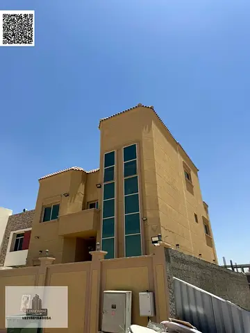 Villa for rent in Ajman, Al Zahiyah area. Ground floor, first floor, and roof. 4 master bedrooms wi