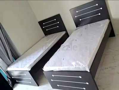 New Pair of single wooden beds with mattresses