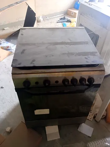 stainless steel 4-burner gas stove with a built-in oven