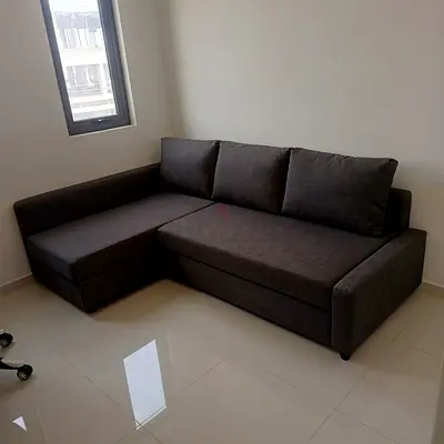 Dark Grey L-Shaped Sofa Bed with Storage - Good Condition