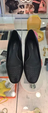 Black woven leather flats - size not specified, gently used