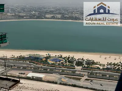 One-bedroom apartment with a living room available for annual rent in La Plage Tower. Features include 2 bathrooms, a laundry room, a balcony, parking