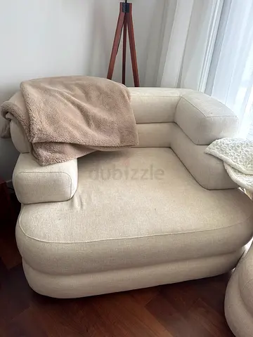 Comfortable beige single armchair — good condition