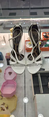 White high-heeled strappy women's sandals, size unknown, gently used