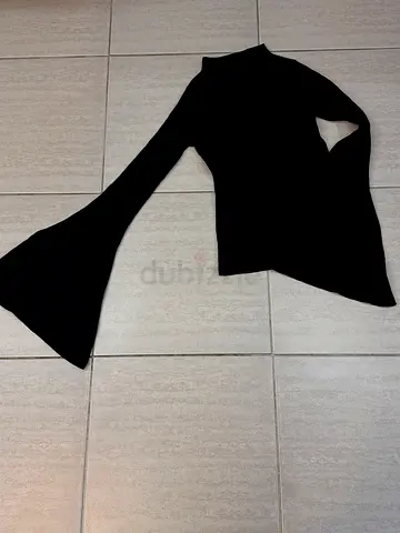 Black long-sleeve top with dramatic flared sleeve, size M