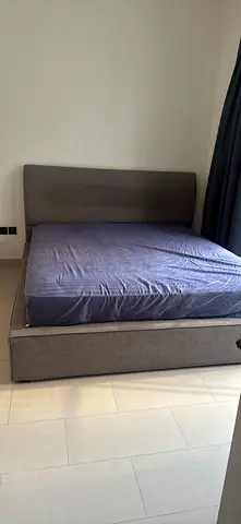 Grey upholstered double bed with storage, good condition