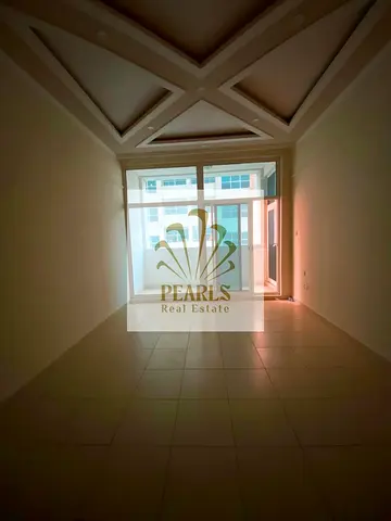 1BR apartment for annual rent in Ajman One, Al Rashidiya 3, with master bedroom, 2 bathrooms, balcony, built-in wardrobes, free gym, pool and parking.
