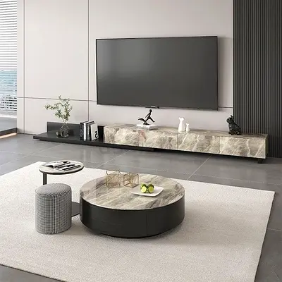 Modern low marble-top TV entertainment unit with matching round coffee table