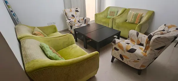 Light green velvet 4-piece sofa set with 2 patterned armchairs and 2 coffee tables