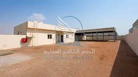 Industrial Yard for Rent in Al Sajaa 10,000 Sq. Ft. 2,500 Sq. Ft. Steel Shed Main Road Location