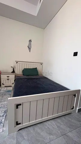 Single wooden bed frame with matching nightstand - good condition