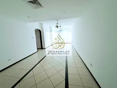 Two bedrooms and a living room for annual rent in Al Majaz 3 area with one month free and easy payment in 4 or 6 installments