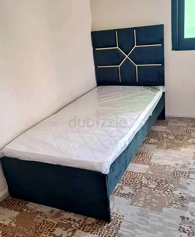 New Single upholstered bed with mattress — modern headboard, good